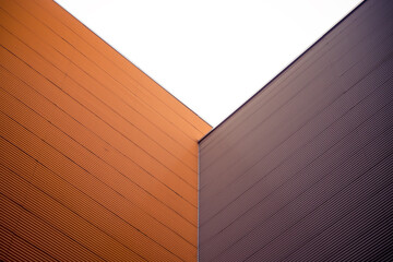 Industrial, urban background. Orange and brown metal walls corner
