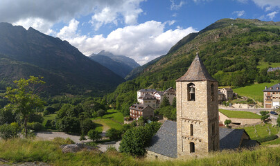 Fototapeta premium UNESCO World Heritage. First Romanesque church of Sant Joan in the village of Boí. (11-12 century). View of the bell tower. Valley of Boi. Spain.