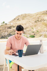 Freelance using devices on a terrace