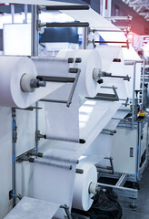 non woven material on automatic machine for the manufacture of medical masks with nanofiber. Coronavirus and Covid-19 Protection