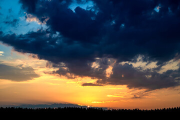 Fototapeta na wymiar Dramatic sky on summer sunset. Beautiful clouds.