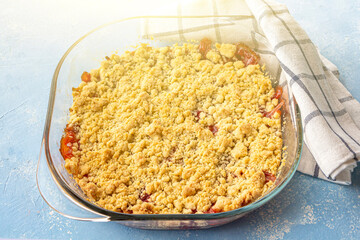 Home сooking. Rhubarb or Strawberry crumble, gluten free crisp in baking dish. Summer dessert on...