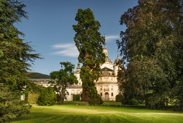 View of the Royal Collegiate Church of the Holy Trinity in baroque style next to the Royal Palace of La Granja de San Ildefonso. - obrazy, fototapety, plakaty