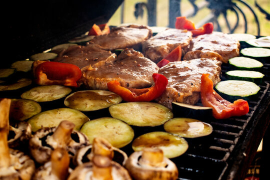 Grilling vegetables and meat. Horizontal photo.