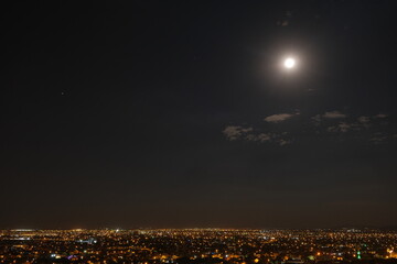Full moon in Konya sky and city lights by taken photo from of the hill and aerial view