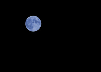 Big Blue Moon on th black sky whitout stars