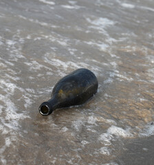 glass bottle that can hold a secret message or the treasure map by the sea