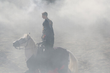 Reconstitution of an equestrian fight of knights during a medieval show