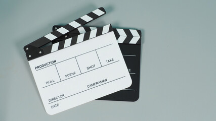 Black and white Clapperboard or clapper board or movie slate use in video production ,film, cinema industry on gray background..