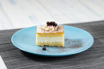 A piece of cake on a blue plate.