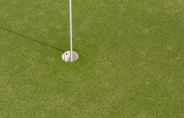Pin and hole of a minigolf course.