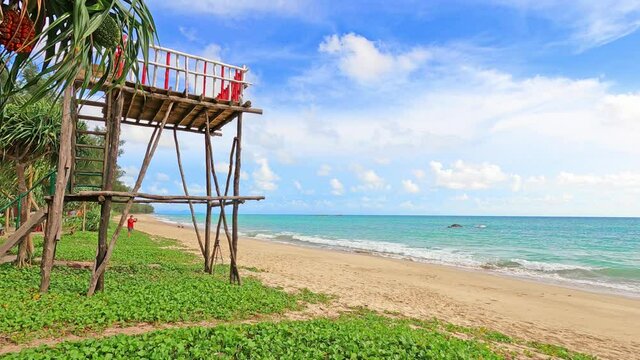 lifeguard tower on tropical summer beach n blue sea