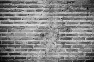 Old brick wall texture shabby grunge texture weathered stained old stucco black and painted black brick wall for background. light shines on modern black brick wall texture for black retro background.