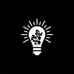 Light bulb with growing plant icon isolated on dark background