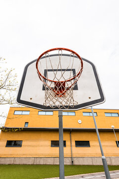 Basket hoop on a school yard.