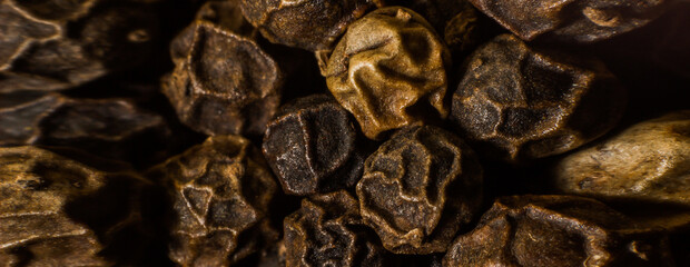 Banner of hot dry peppercorns. Condiments and spices.