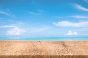 Fototapeta na wymiar wood terrace over blue sea and tropical island beach background.