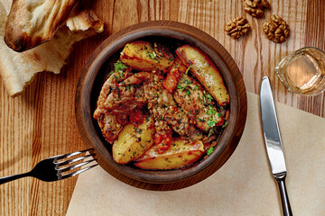 Ojakhuri from roasted lamb with potatoes in clay ketsi pan