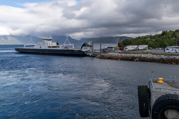 cars and trucks waiting to board the ferry to the Lofoten Islands in Bogenes in northern Norway