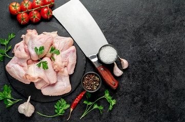  raw chicken wings on stone background with copy space for your text