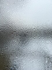 view from the window wet glass covered with wet flowing water, snow melts