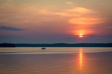 The orange sunset and the sail over the Minsk sea, Belarus