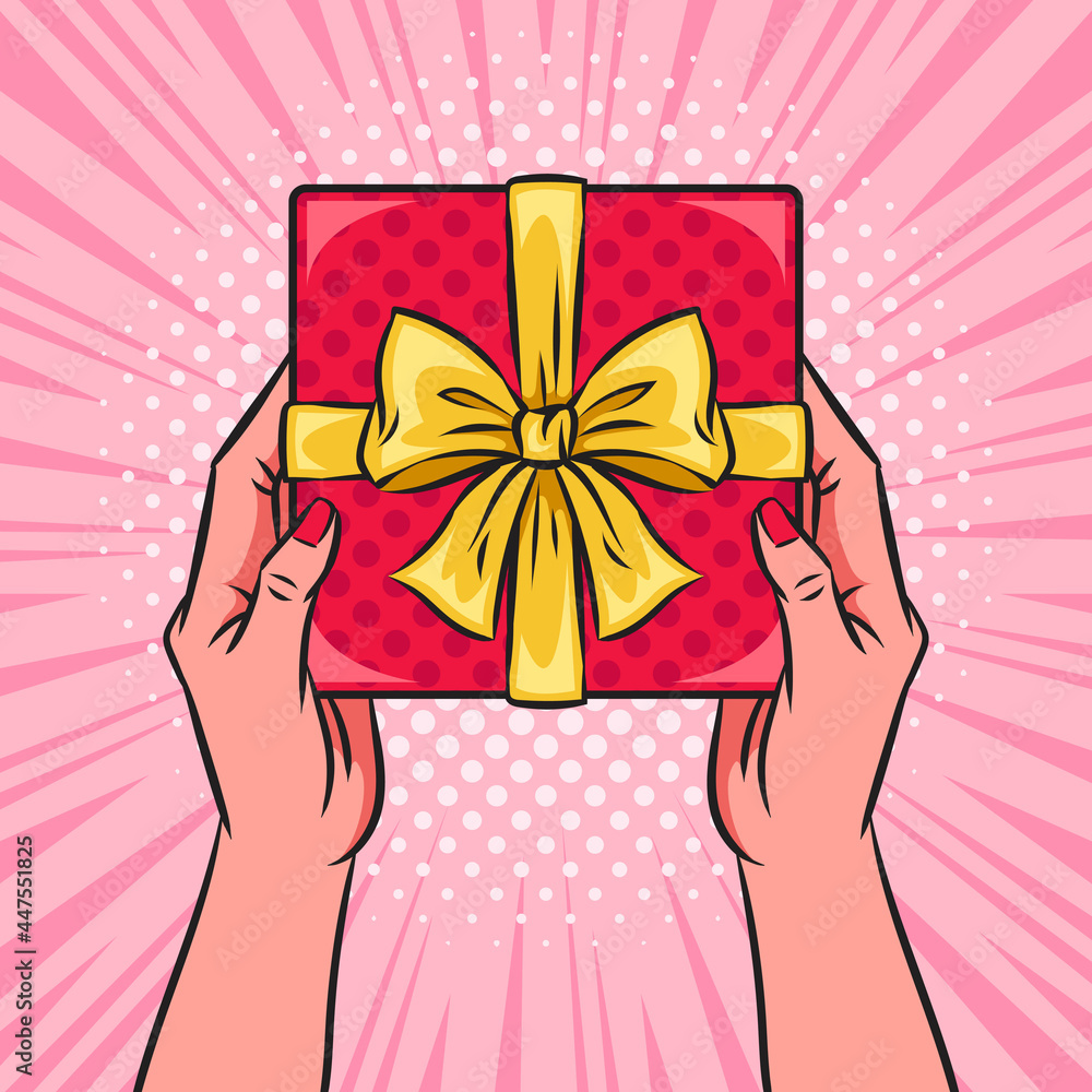 Wall mural hands holding red gift box or present with a bow and ribbons. pop art vector comic illustration. top