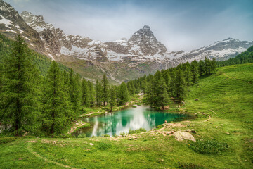 The scenic Blue Lake (Lago Blu) surrounded by a beautiful alpine landscape near Cervinia, Aosta...
