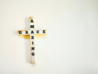 Christianity Concept -  Text of amazing grace with cross background. Stock photo.