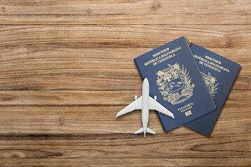 Venezuelan passports are issued to citizens of Venezuela to travel outside the country. two passport , miniature airplane