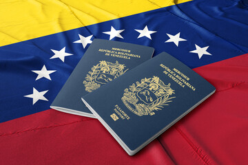 Venezuelan passports are issued to citizens of Venezuela to travel outside the country. Passport on the Venezuelan flag
 - obrazy, fototapety, plakaty