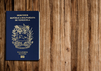 Venezuelan passports are issued to citizens of Venezuela to travel outside the country. wood background 