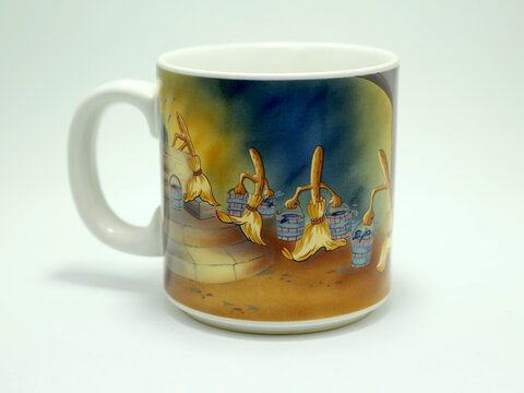 Mug from the Walt Disney movie Fantasia. The Sorcerer's Apprentice. Classic animated cinema with Mickey Mouse and music as the protagonists. Souvenir Disneyland parks. Dance of the brooms. 50 years.