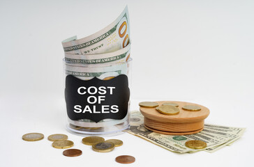 There is a bank with money on the table, it says - COST OF SALES