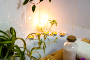 Spa-beauty salon, wellness center. Spa treatment aromatherapy for a woman's body in the bathroom with candles, oils and salt.