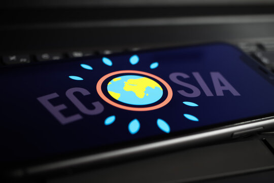 Viersen, Germany - June 1. 2021: Closeup of mobile phone screen with logo lettering of ecosia search engine on computer keyboard