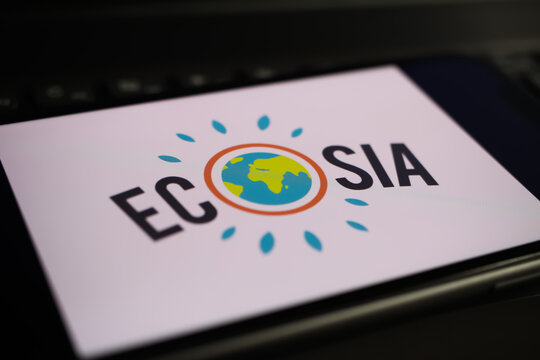 Viersen, Germany - June 1. 2021: Closeup of mobile phone screen with logo lettering of ecosia search engine on computer keyboard