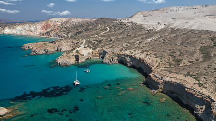 Fototapeta premium Aerial drone photo of beautiful volcanic emerald paradise bay below white rock with perlite mine, Milos island, Cyclades, Greece
