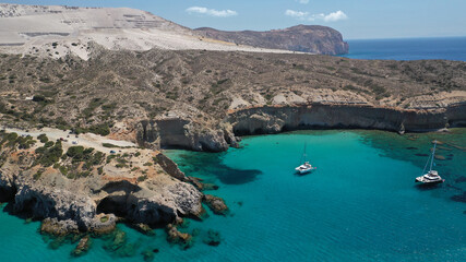 Obraz premium Aerial drone photo of beautiful volcanic emerald paradise bay below white rock with perlite mine, Milos island, Cyclades, Greece