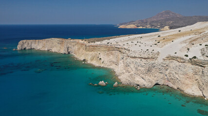 Aerial drone photo of beautiful volcanic emerald paradise bay below white rock with perlite mine, Milos island, Cyclades, Greece