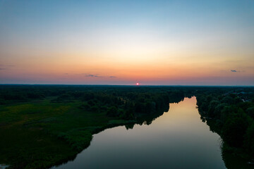 Fototapeta premium Aerial view of the river at sunset