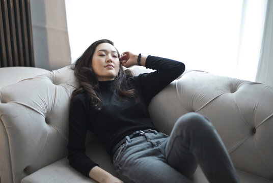 young woman sleeps on the sofa