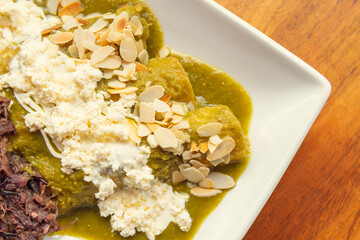 Gourmet green eggs with beans. Traditional Mexican food with beans.