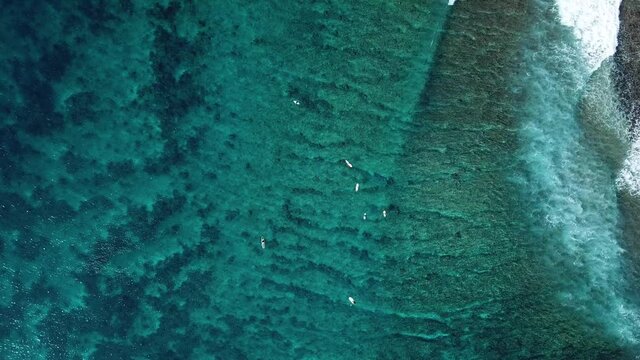 Aerial view of surfers on sea waves, Maldives