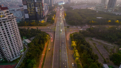 Fototapeta premium Traffic jam on the polluted streets of Jakart. Has the highest number of motor vehicles and the traffic congestion is limited in few areas. Jakarta, Indonesia, July 28, 2021
