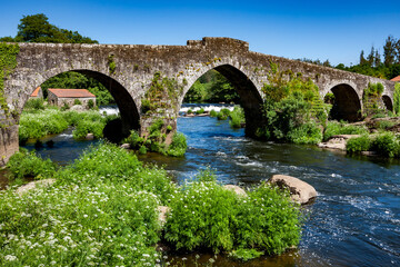 Fototapeta na wymiar Roman bridge on the Camino de Santiago near Maceda, Galicia, Spain, Europe.