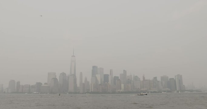 Downtown New York City Skyline With Helicopters Flying Overhead In Heavy Haze