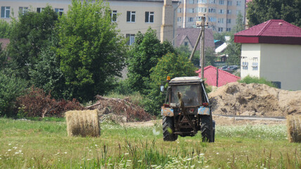 A tractor collecting a village. Industry