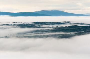 Solińskie Lake bathed in morning fog, Solina, Bieszczady, sunrise