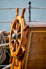 wooden ship's wheel of a tall ship